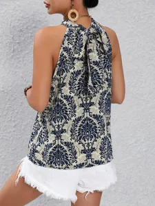 Detailed view of the women's halter neck top featuring elegant retro blue damask print.