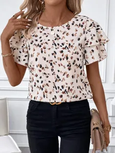 Close-up detail of women round neck ruffle short sleeve printed blouse fashion style.