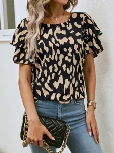 Close-up detail of the women's abstract printed short sleeve top with layered ruffles.