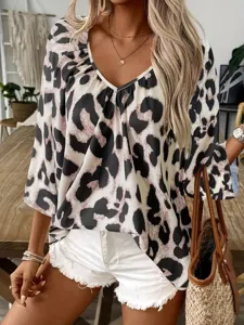 Detailed view of women's V-neck leopard print blouse showing stylish collar design.