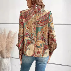Detailed view showing the back of a stylish printed high neck smocked long sleeve blouse.