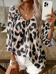 Leopard print V-neck women's blouse detail shot, casual commuting style fashion top.