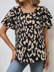 Women's short sleeve ruffle trim leopard print blouse detailed view showing round neckline.