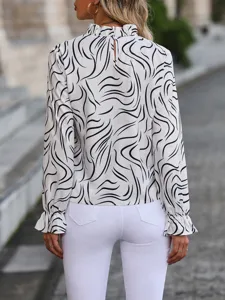 Back view detail of women's black and white abstract wavy print long sleeve ruffle blouse.