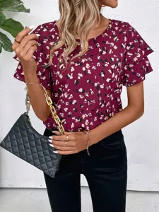 Close-up detail view of the floral print short sleeve blouse featuring double ruffle sleeves.