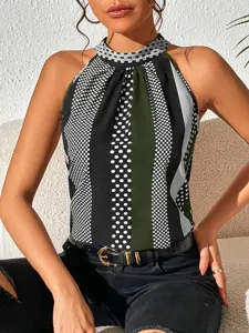 Close-up detail of the stylish halter neck sleeveless top featuring geometric print and dots.