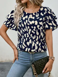 Women's summer short sleeve navy blue abstract print blouse with double layered ruffle sleeves.