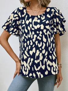 Chic navy blue short sleeve blouse with layered ruffle sleeves and abstract print detail.