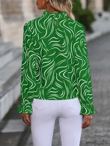 Green abstract print long sleeve blouse back detail with elegant ruffles and button closure.