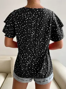 Women's summer black and white polka dot casual loose short sleeve ruffle top detail view.