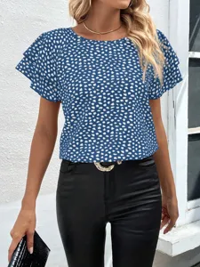 Close-up detail of the stylish blue short-sleeve top featuring white spot print and ruffles.