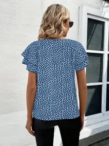 Detail view of a blue abstract printed short sleeve blouse with cute ruffle sleeves.