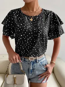 Detailed view of women's black polka dot ruffle sleeve casual blouse paired with denim shorts.