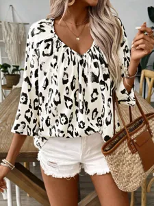 Detailed view of stylish V-neck leopard print blouse for women, featuring casual loose fit design.