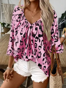 Pink leopard print V-neck long sleeve casual blouse paired with white denim shorts.