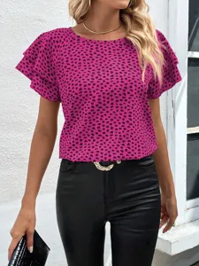 Close-up detail of women's short sleeve blouse featuring bold pink and black animal print.