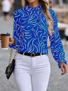 Blue and white abstract swirl print long sleeve blouse with ruffled mock neck for women.