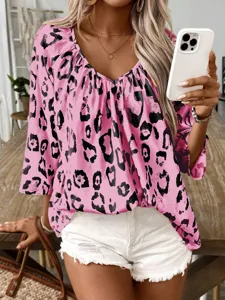 Pink leopard print V-neck women shirt detail shot, casual commuting style apparel presentation.