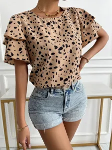Detailed view of women casual short sleeve blouse with black abstract dot print ruffle sleeves.