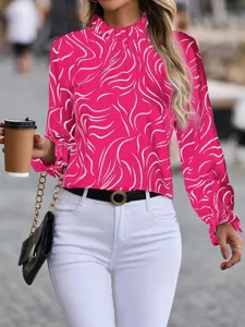 Detailed view of the pink abstract print long sleeve blouse with elegant ruffle collar design.