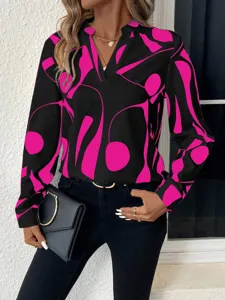 Detailed view of the women's abstract printed V-neck long sleeve blouse in black and pink.
