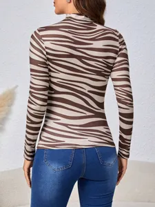 Back view detail of brown zebra print mock neck long sleeve top showing slim fit design.