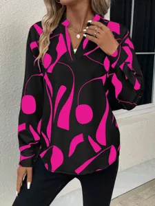 Casual long sleeve V-neck blouse featuring a striking black and pink abstract print design.