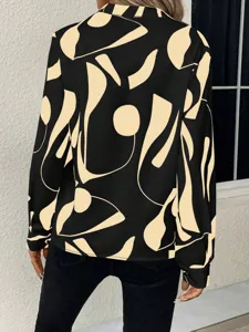 Back detail of abstract print long sleeve blouse, casual V-neck design and loose fit.