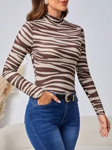 Detail shot of a stylish brown zebra print mock neck long sleeve top for women fashion.