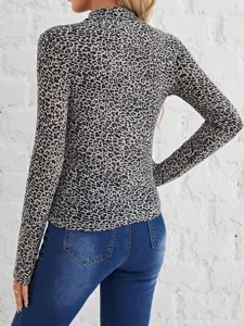 Close-up detail showing the back view of the stylish leopard print long sleeve top for women.