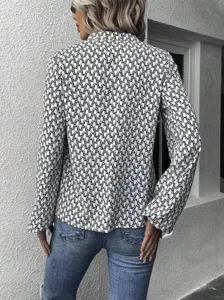 Back view detail of women's black and white printed pleated collar lantern sleeve chic blouse top.
