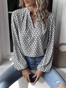 Chic long sleeve geometric print blouse with elegant V-neck and lantern sleeves for women.