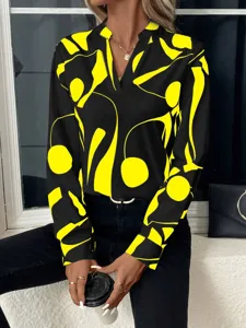 Casual long sleeve V-neck blouse with striking black and yellow abstract print design.
