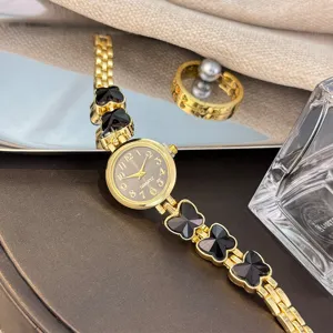 Damen Quarzuhr Armbanduhr Goldfarben Schwarzes Kleeblatt Design Modisch Elegant chic