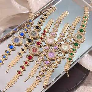 Detail view of women rhinestone luxury stone quartz watch, fashion orbital bracelet wristwatch.