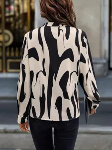 Casual long sleeve shirt with abstract black and white print, stylish womens apparel detail.