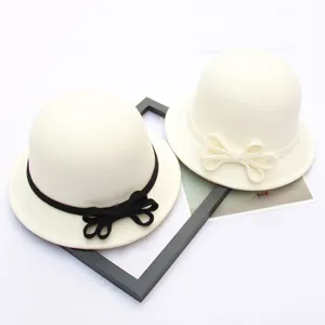 Detail shot of elegant dome wool bowler hat with cute bowknot design for women daily wear.
