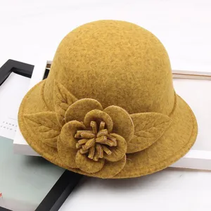 Close-up detail of the woolen dome bucket hat with exquisite 3D felt flower decoration.