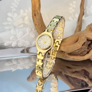 Elegant gold quartz watch with slim metal strap and small dial for women daily wear style.