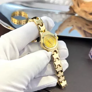 Elegant small dial quartz watch for women with fine gold metal strap, stylish daily wear.