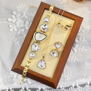 Detailed view of the irregular crystal geometric watch necklace ring earrings four-piece set.