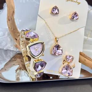 Detailed view of the luxury irregular pink crystal quartz watch necklace ring and earrings jewelry set.