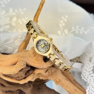 Delicate women's quartz watch featuring a small dial and fine gold tone link bracelet stylish.