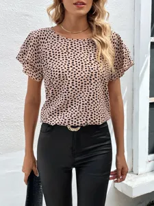 Detailed view of women short sleeve dot print blouse, ruffle layered cuffs, soft fabric.