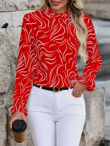 Detailed view of women red abstract print ruffle long sleeve blouse worn by model outdoor