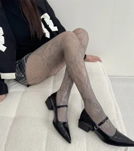 Women elegant floral lace tights, vintage mesh pantyhose for stylish autumn daily wear.