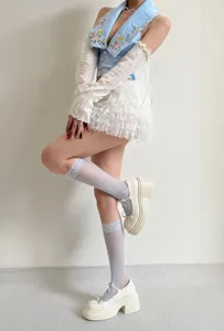 Breathable lace arm sleeves and sheer summer socks paired with sweet lace vest and cute skirt.