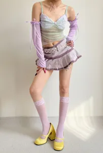 Detail view of breathable lace sleeves and matching mesh socks with cute ribbons for summer.