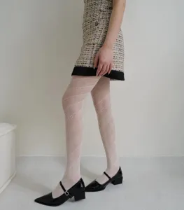 Textured jacquard pantyhose featuring diagonal stripes and hollow pattern, ideal for autumn style.