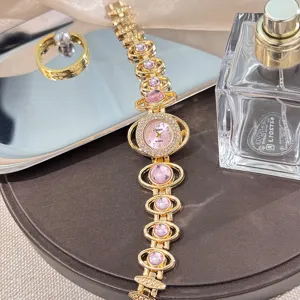 Fashion luxury rhinestone quartz watch for women with star bracelet design detail.